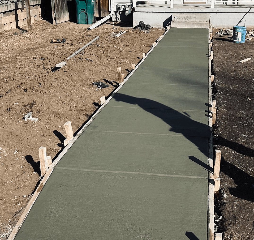 Freshly poured concrete walkway drying Freshly poured concrete walkway drying